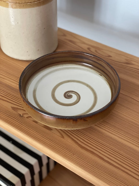 Brown earthenware bowl with swirl