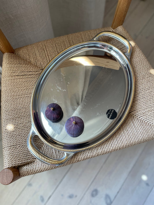 Alessi steel dish with twisted gold edge