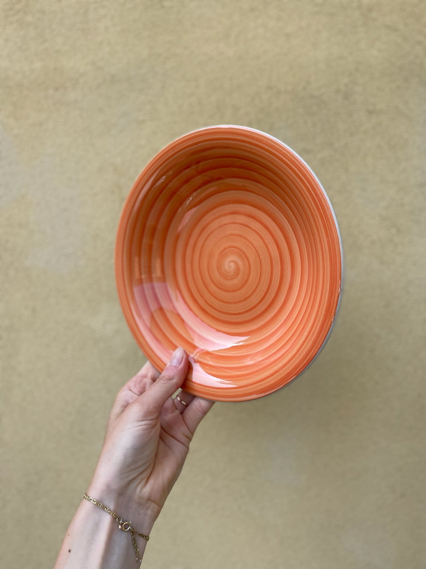 Dyb orange tallerken med swirl