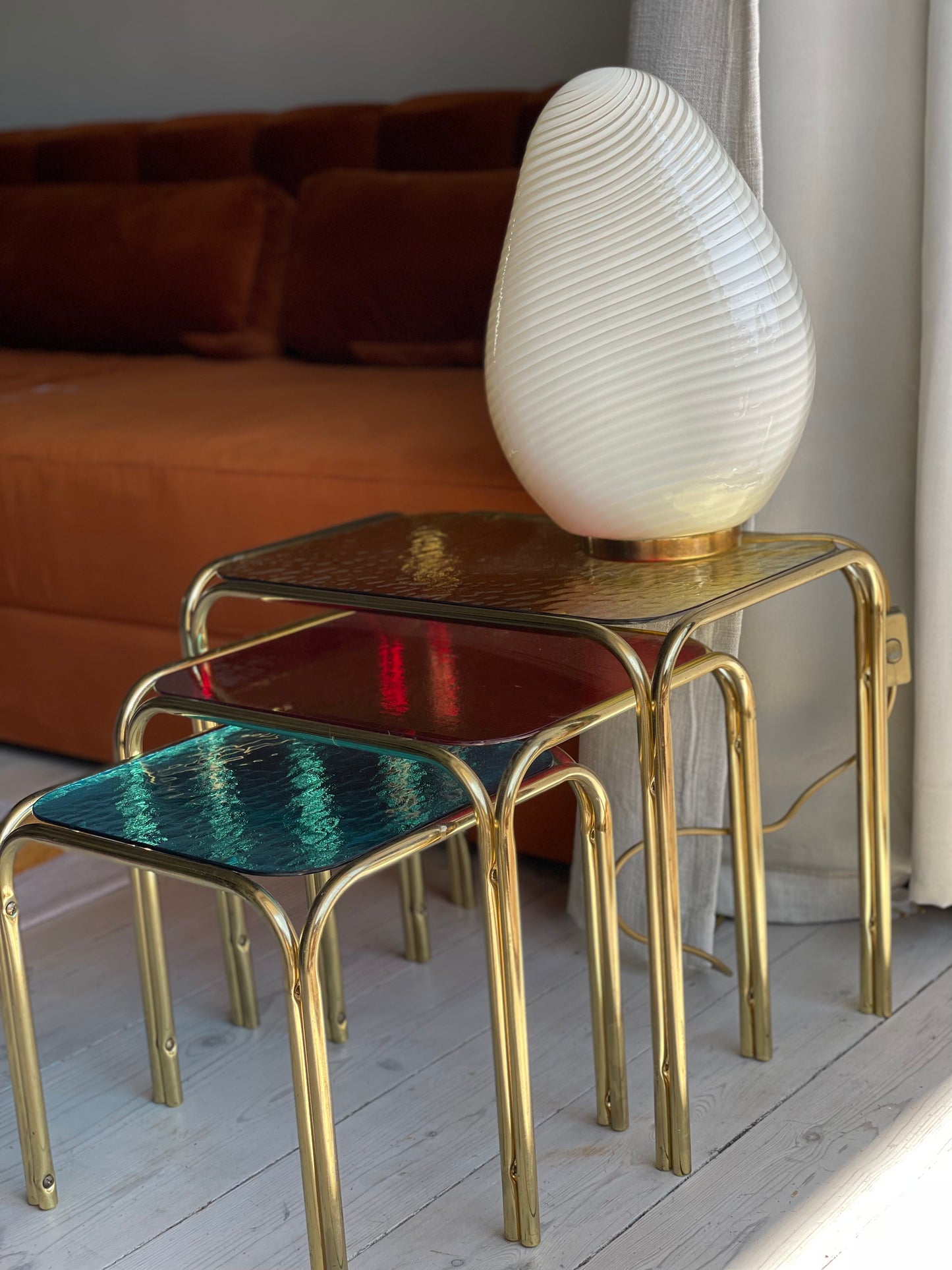 Brass insert tables with colored glass tops
