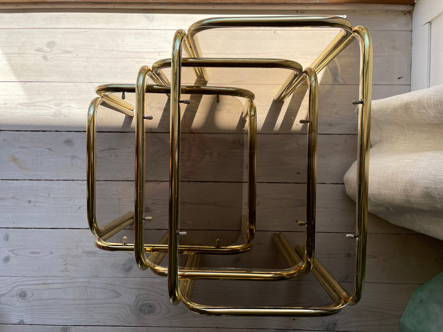 Brass insert tables with smoked glass