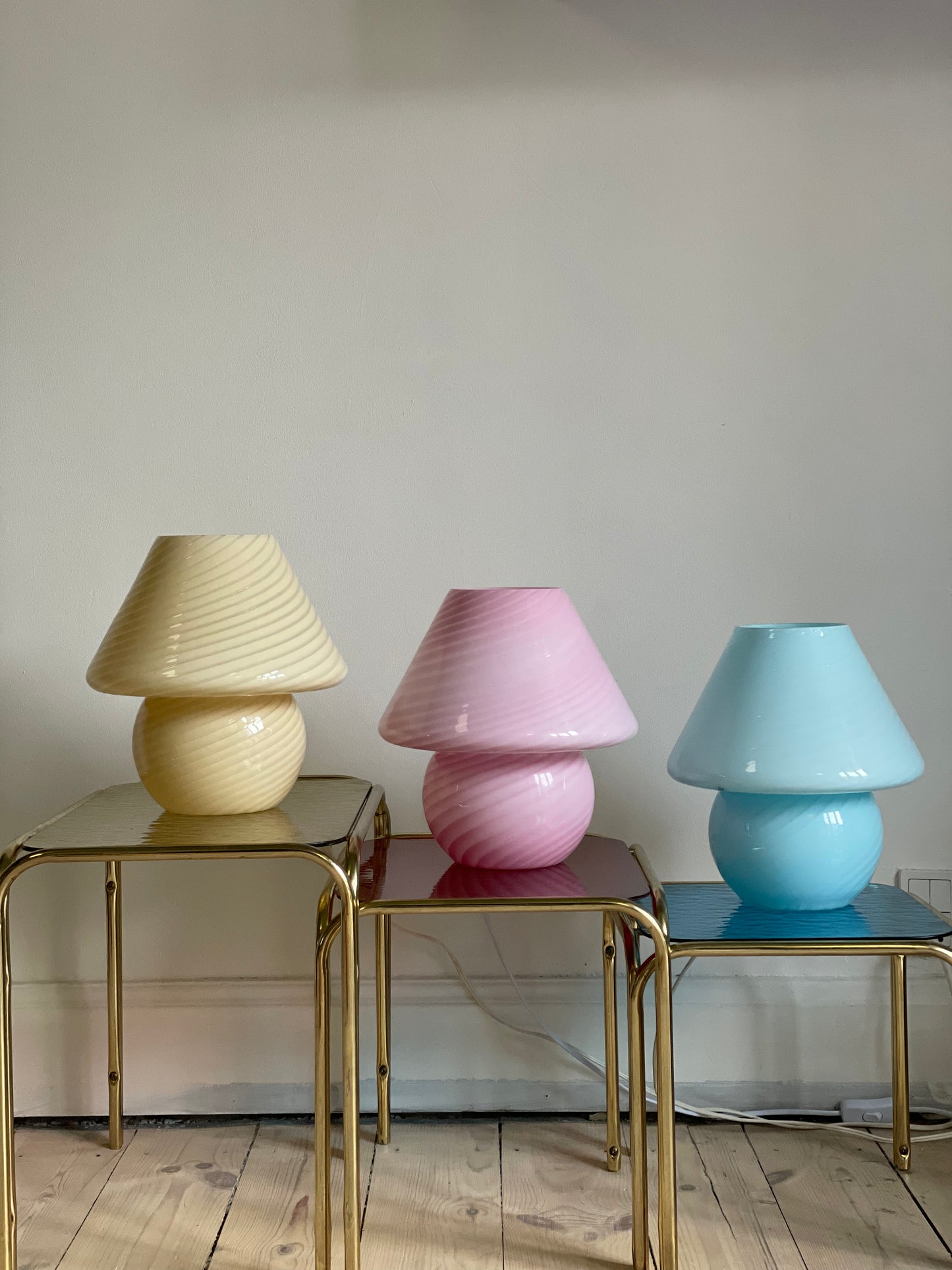 Brass insert tables with colored glass tops