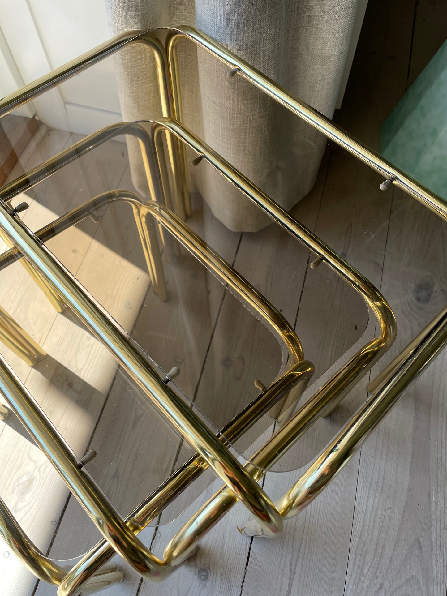 Brass insert tables with smoked glass