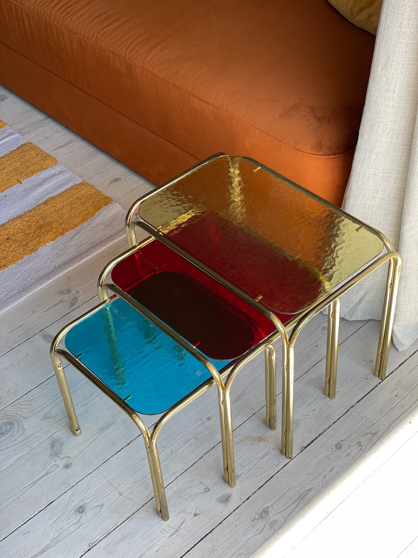 Brass insert tables with colored glass tops