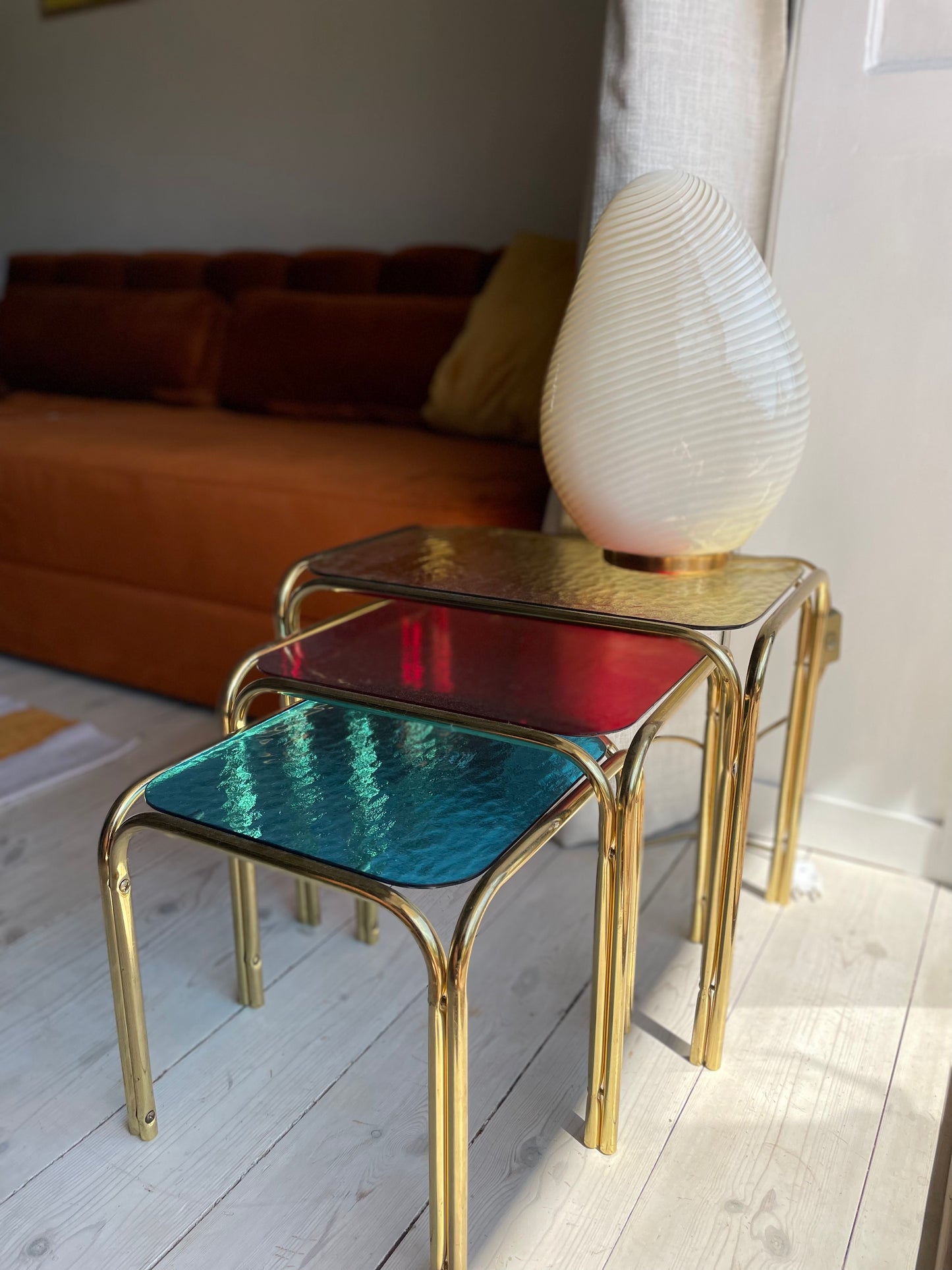 Brass insert tables with colored glass tops