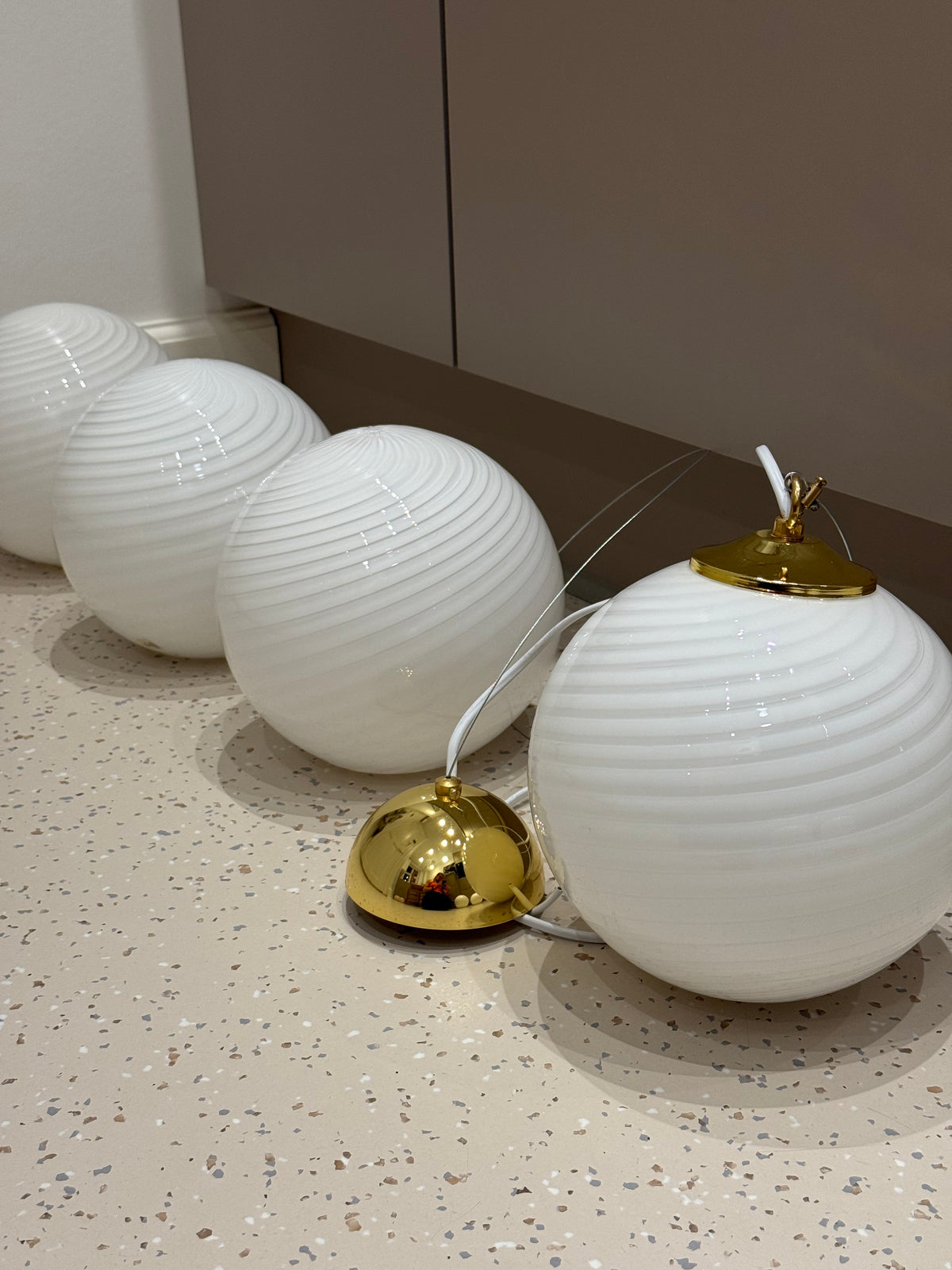 Four matching vintage Murano mini pendants in white swirl glass with brass fittings