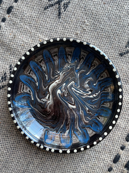 Earthenware dish with black and blue marbled glaze