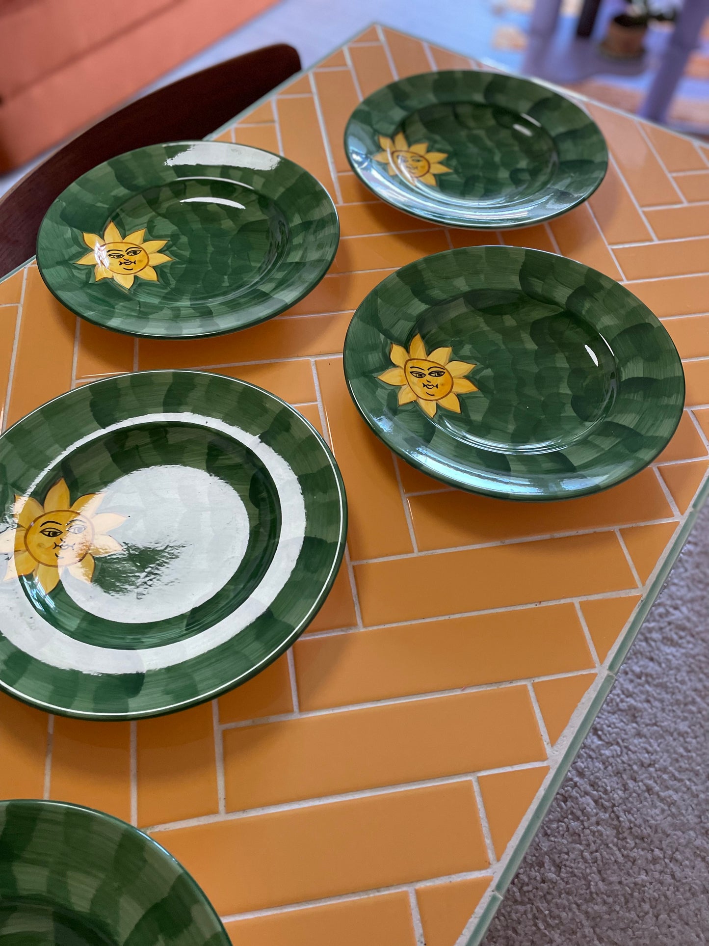 Green deep plates with happy sun