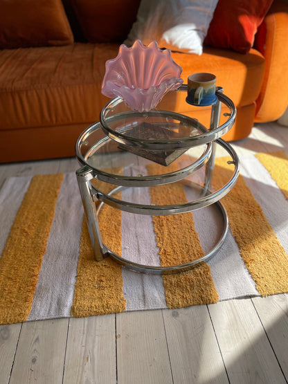 Swivel coffee table in chrome and glass