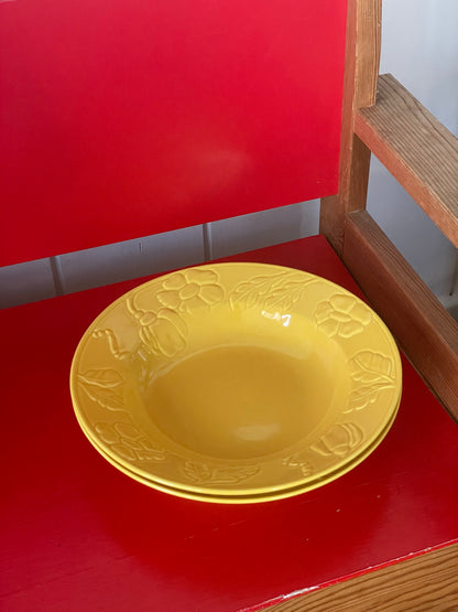 Deep yellow plate with flowers