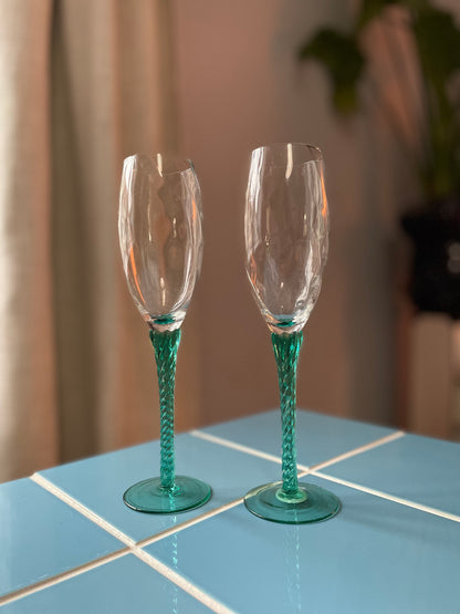 Champagne glass with green twisted foot
