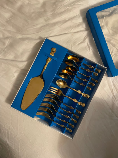 Set of gold colored cake cutlery
