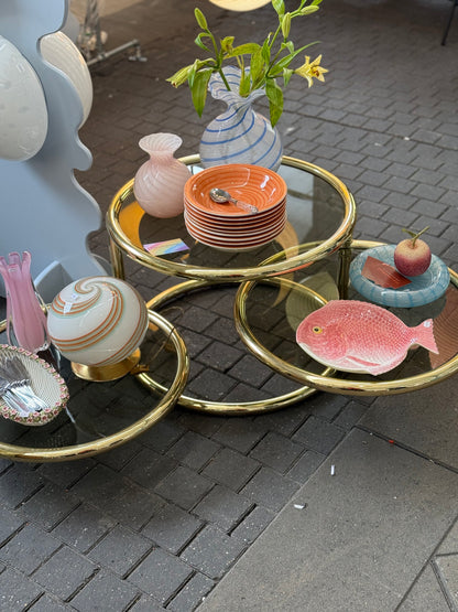 Round swivel glass table in brass