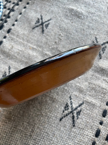 Earthenware dish with black and blue marbled glaze