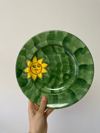 Green dinner plates with happy sun