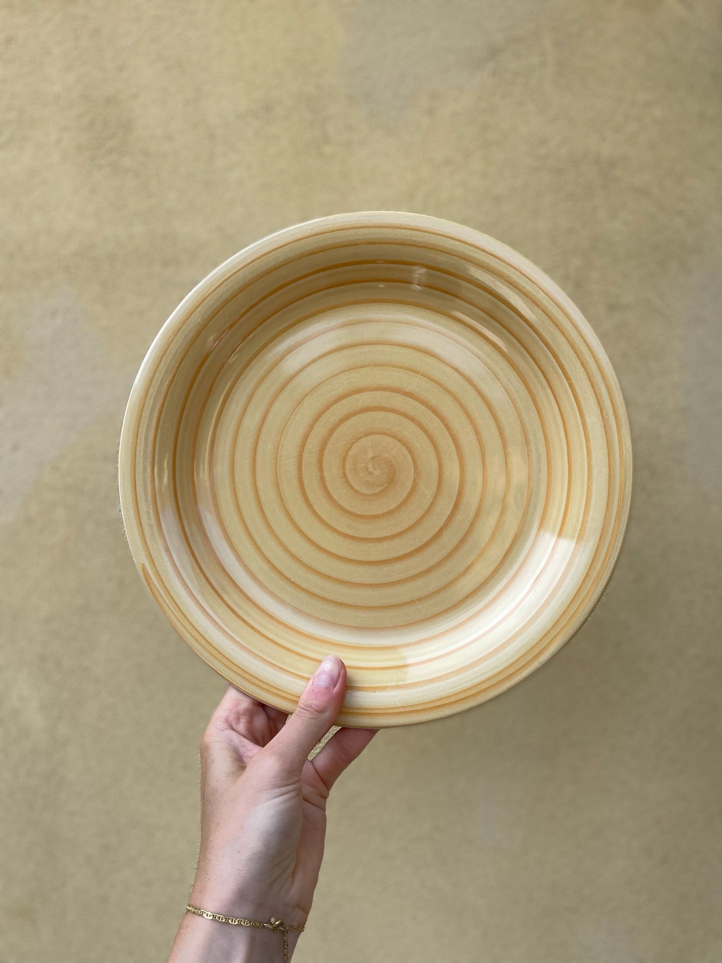 Yellow dinner plate with swirl