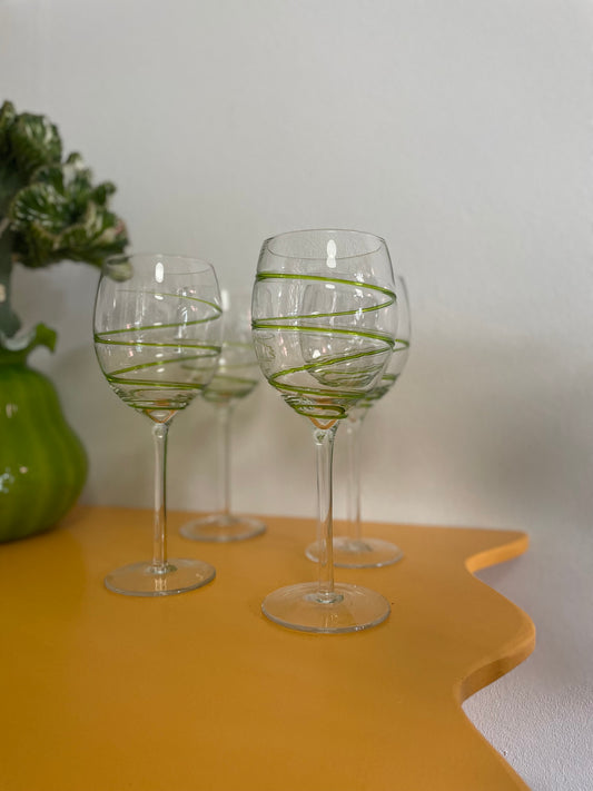 Large wine glasses with green twisted detail