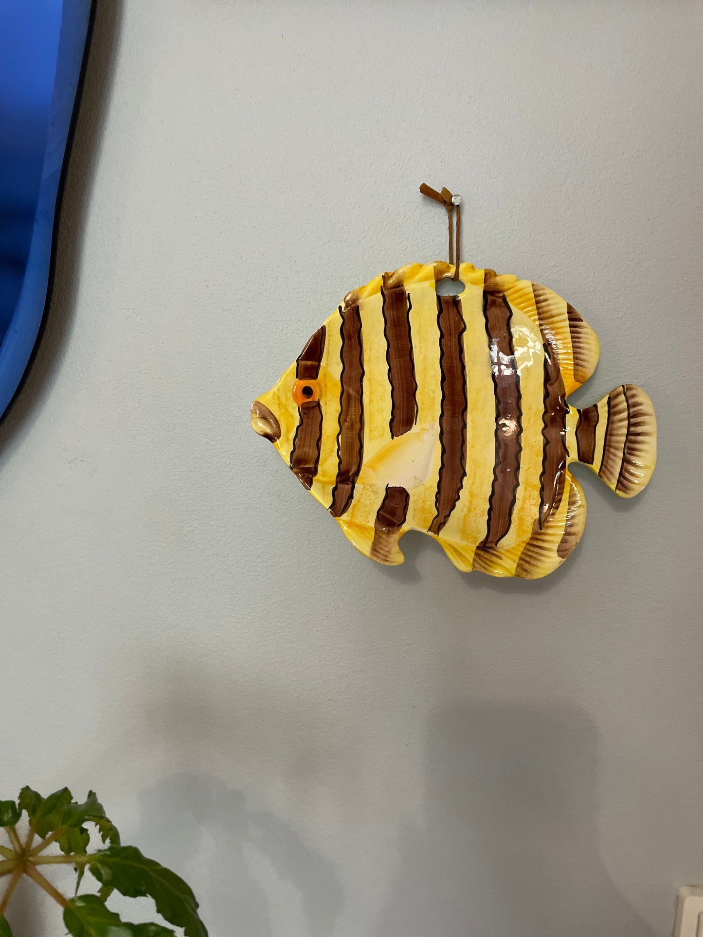 Adventurous fish as a dish or wall hanging