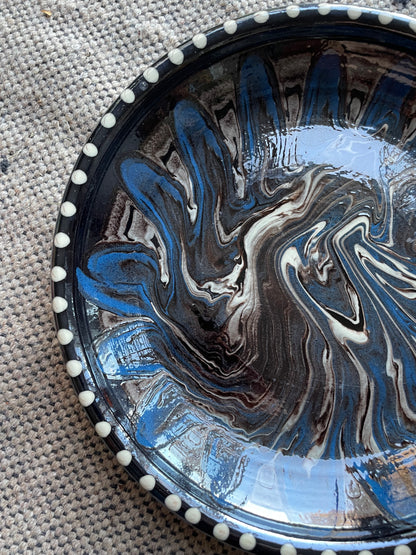 Earthenware dish with black and blue marbled glaze