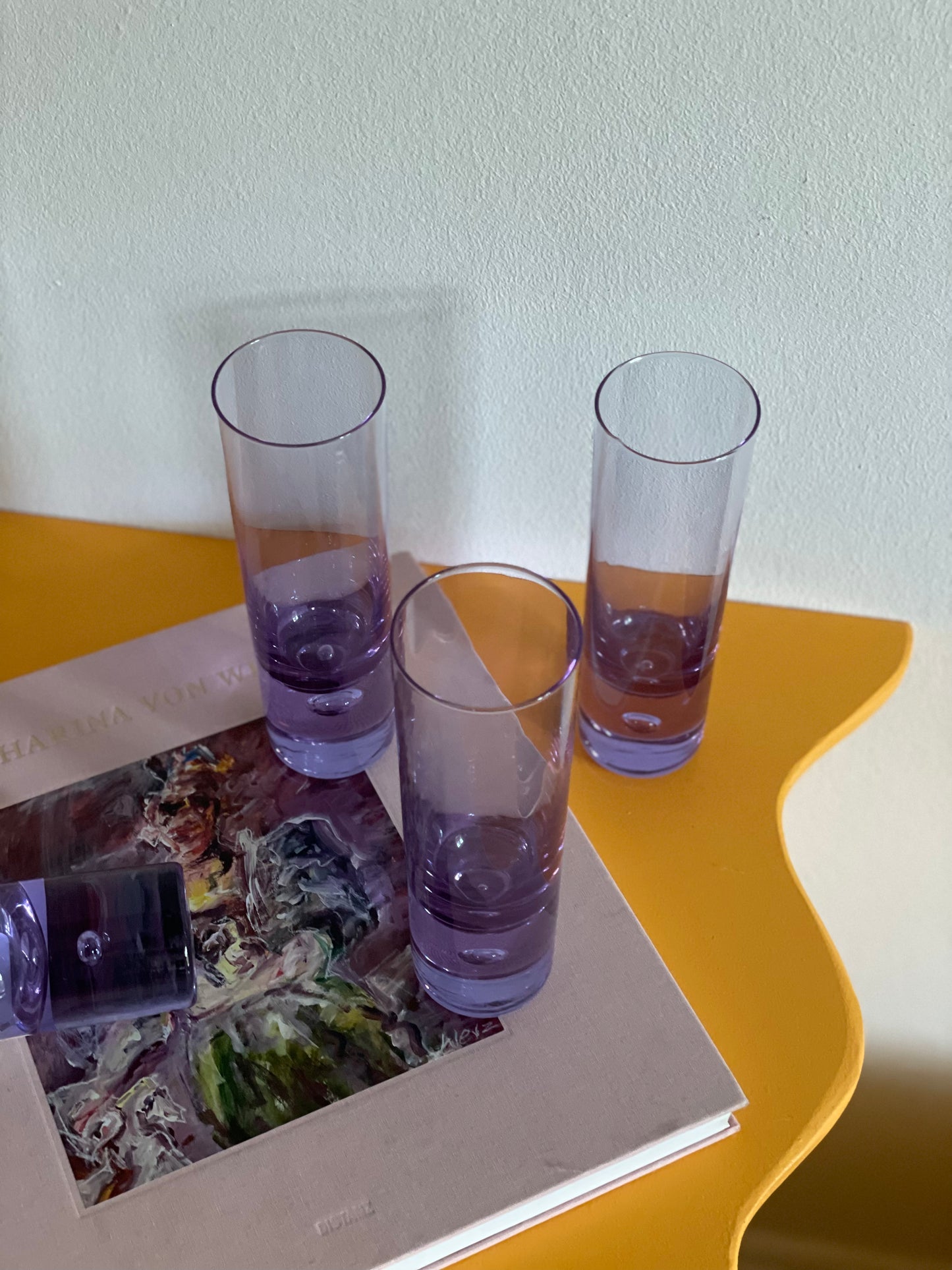 4 Tall purple glasses with bobble in the base