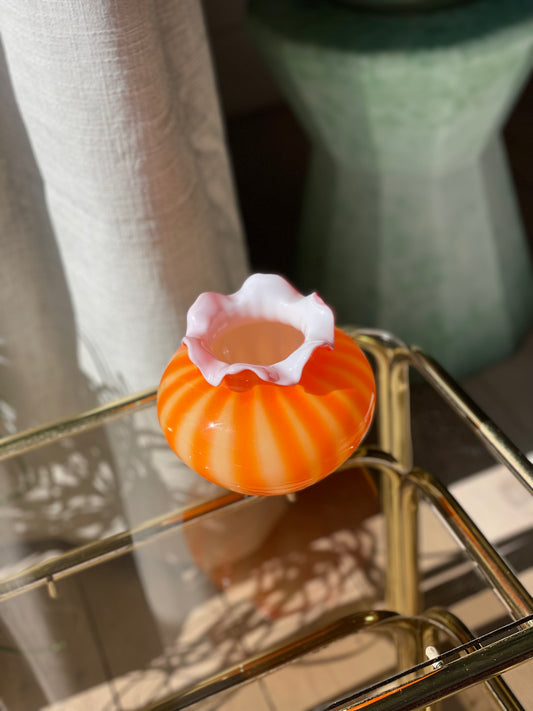 Orange chubby glass vase with fringed edge