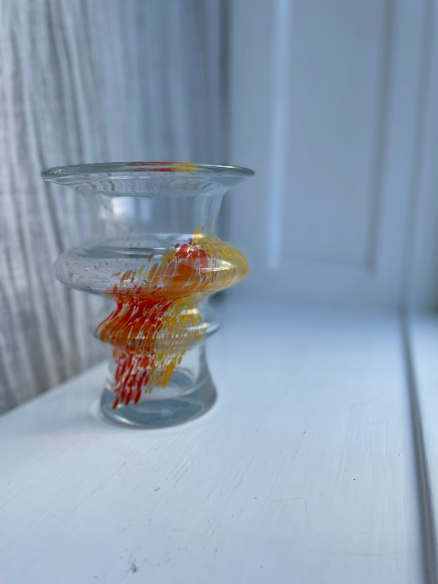 Glass vase with orange/yellow/white splash