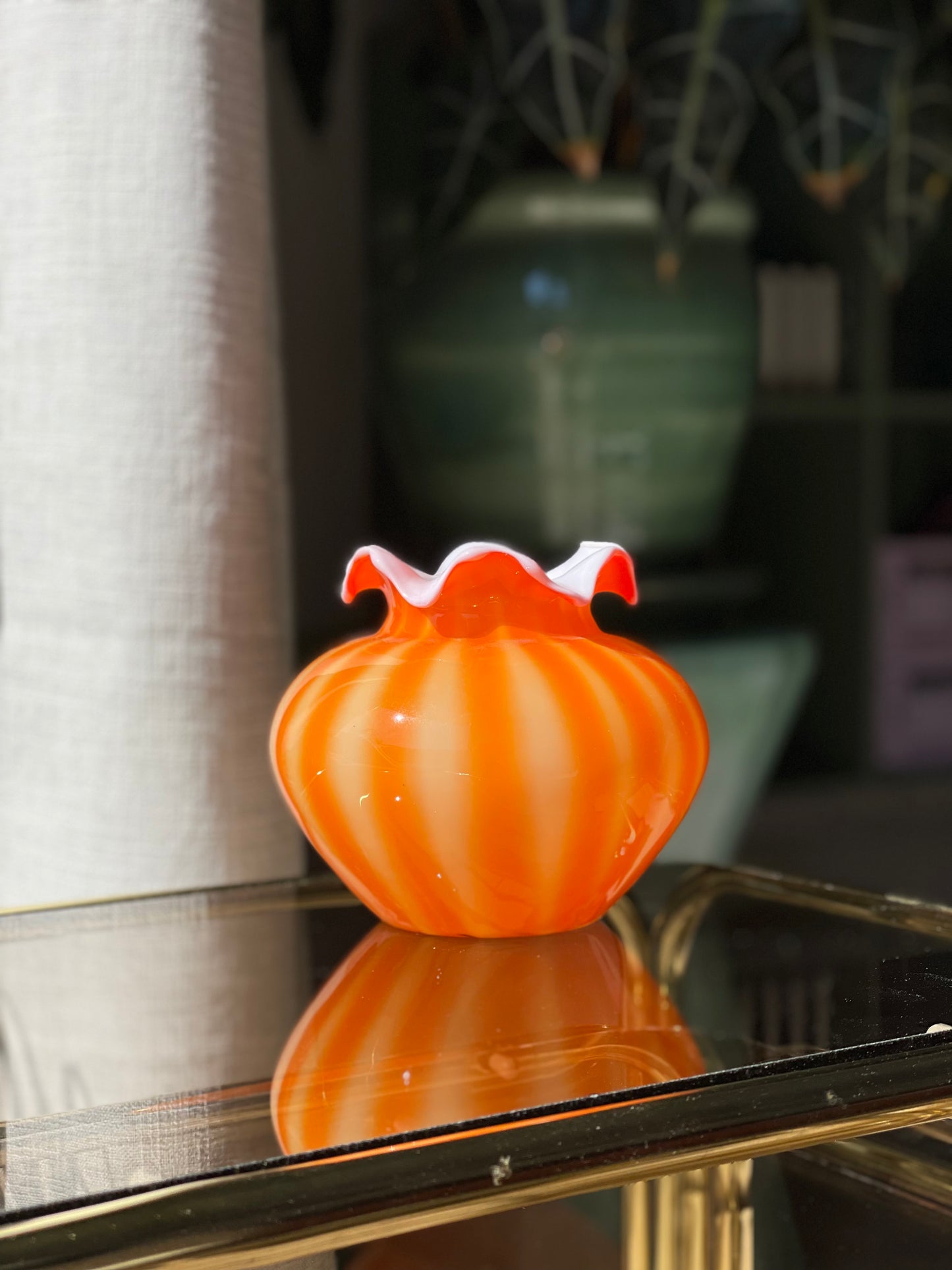 Orange chubby glass vase with fringed edge