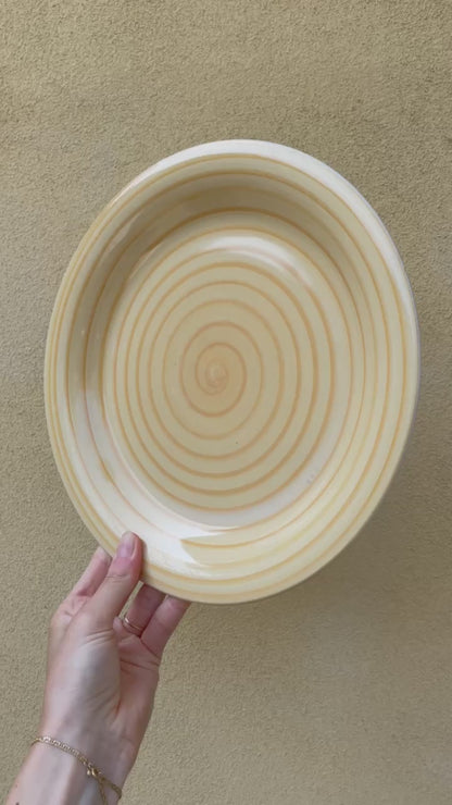 Yellow dinner plate with swirl