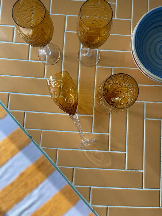 Amber wine glasses with swirl pattern