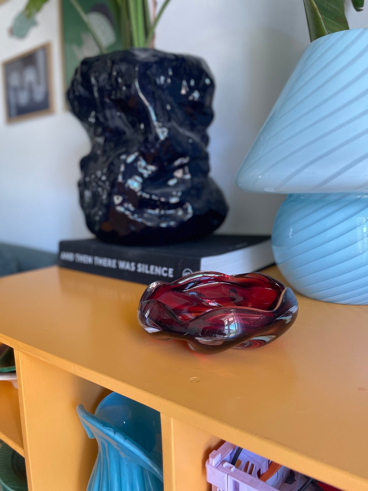 Solid red glass bowl with swirl