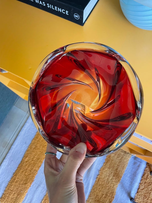 Solid red glass bowl with swirl